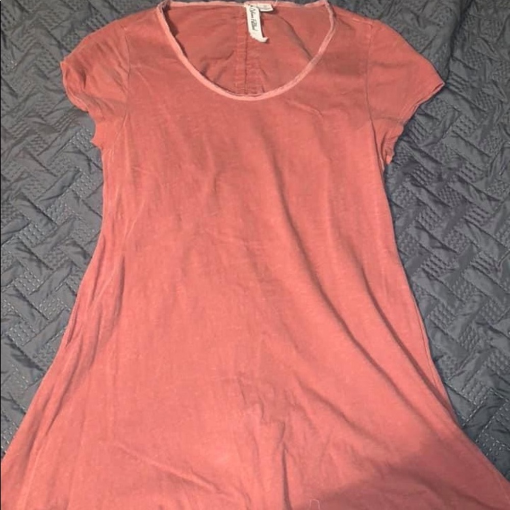 Rose colored top with open back